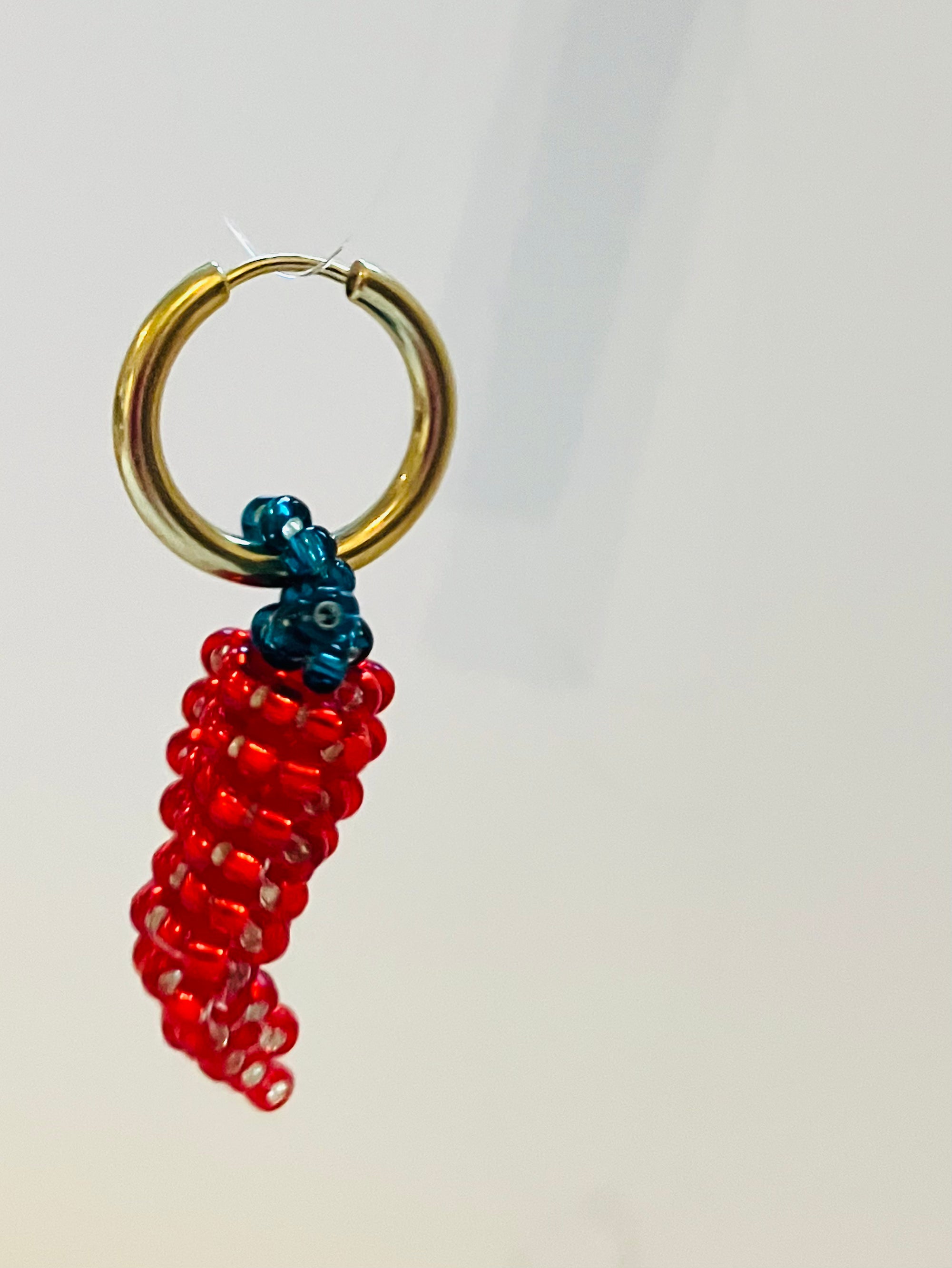 Handbeaded light red pepper earring